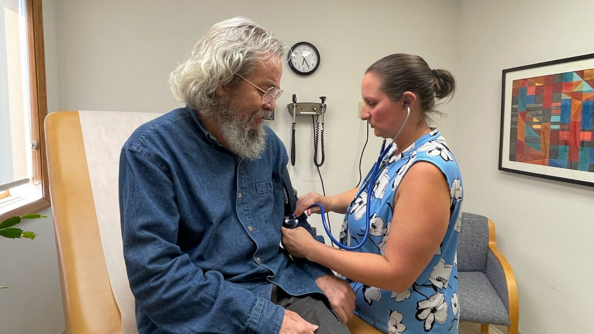 Nurse caring for a patient at our free primary care clinic in Oneonta