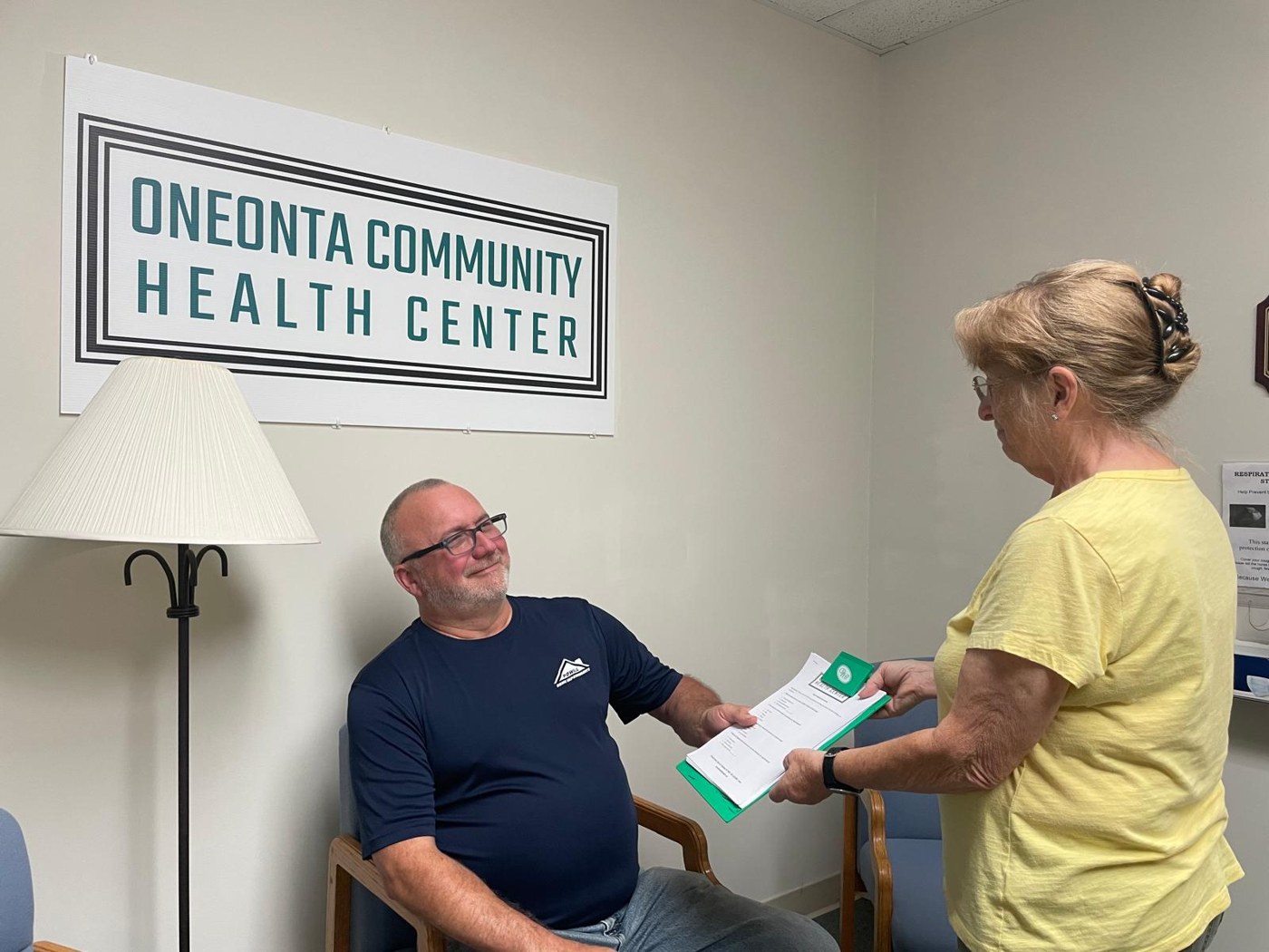 A patient speaking with a staff member